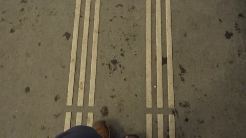 Point of view shot of man walking on pavement Vidéo 328403387