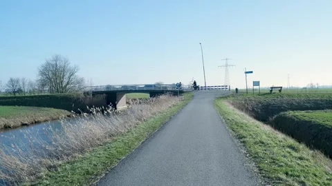 Point of view shot riding a bicycle on a country road Stockbeeldmateriaal 331188654