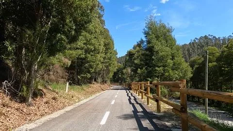 Point of view shot of riding a bicycle along a scenic trail in Sever do Vou.. Stock Photos