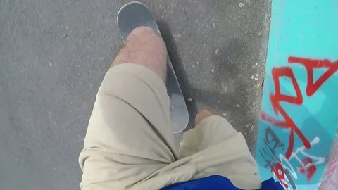 Point of view shot of skateboarder chasing after his skateboard Stock Footage 74824413