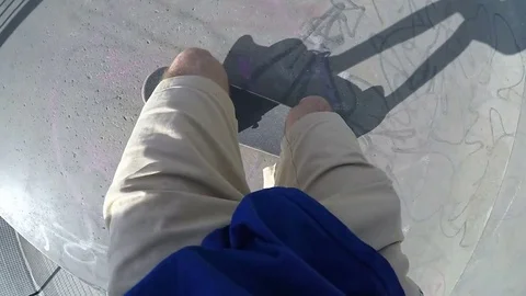 Point of view shot of skateboarder doing a jump, in slow motion Stock Footage 74824746