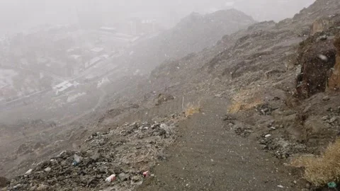 Point of view shot steep pathway going down from the hill top during the windy s Stock Footage 240710956