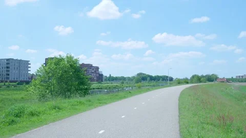 Point of view shot traveling down an asphalt path in the countryside Видео 336903272