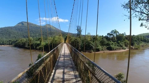Point of view shot, walking on  a hanging bridge over a river, India Vídeo Stock 119313870