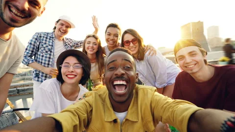 Point of view shot of young people multiethnic group taking selfie and holding Stock Footage