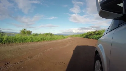 Point Of View Of A Silver Van Driving Down An Abandoned Red Dirt Road Stock Footage 83927494