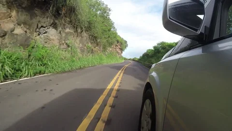 Point Of View Of A Silver Van Driving Down A Narrow Twisty Road  Video stock 83927539