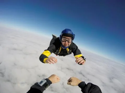 Point of view of a skydiver over the clouds. 写真素材