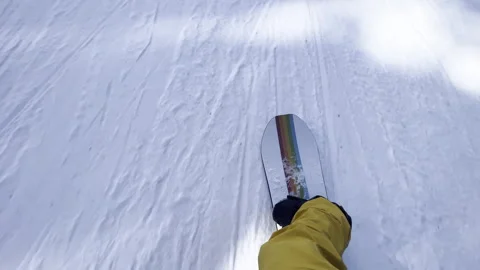 Point of view of a snowboarder on a ski slope on a Stock Footage 254021674