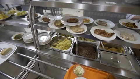 Point of view taking food on the tray in modern plant canteen Stock Footage 85393431