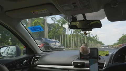 Point-of-View taxi ride through city streets filmed through windshield Stock Footage 327850180