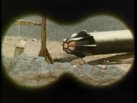 Point of view through binoculars of missile by well, 1970s Stock-Footage 260258429
