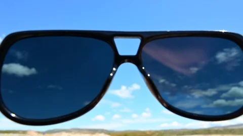 Point of view through sunglasses of idyllic beach sky sea clouds Stock Footage 109059905