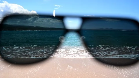 Point of view through sunglasses of idyllic beach with seashore - cinemagraph Stock Footage 109061136