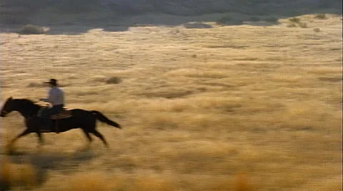 Point of view from train passenger window tracking shot of cowboys on horseback Stock-Footage 29807525