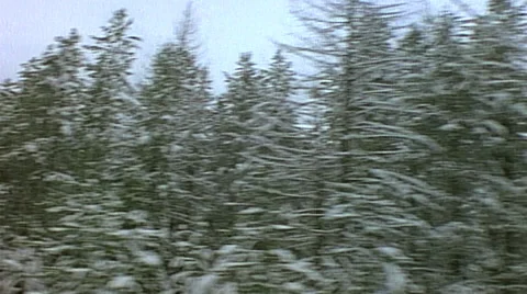 Point of view from train passenger window of winter mountain range in background Stock Footage 29807594
