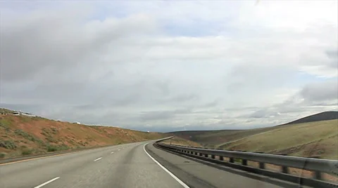 Point of view - traveling Interstate 82 rolling hills of Southern Washington Stock Footage 39744718