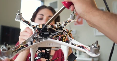Point of View of two hands welding the inside of a robot being held by an Vídeo Stock 84291846