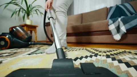 Point of view of a vacuum cleaner rolling back and forth on a colorful carpet. Stock Footage 242993653