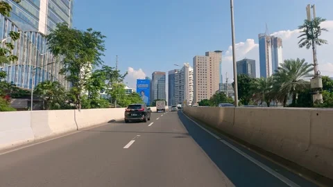 Point of view video of a car driving in Jakarta modern business district Stock Footage 158848663