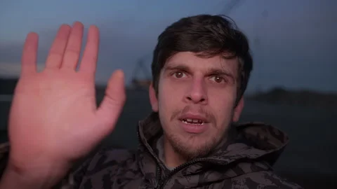 Point of View Video of Young Man in Work Gear Conducting Video Chat Against.. Stock Footage 233689656