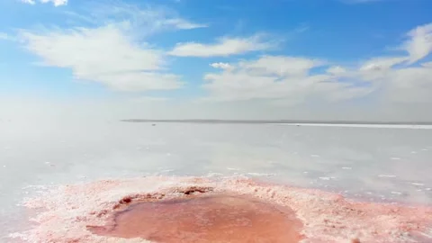 Point of view waking on textured salt lake barefoot in sunny day. Healthy pro Stock-Footage 188031413