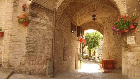 Point of view walk under the arch in Assisi center Stock Footage 82113855