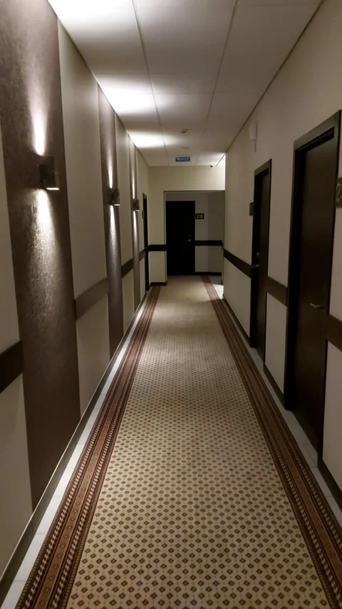 Point of view - walking down a hotel hallway Stock Footage 302943194