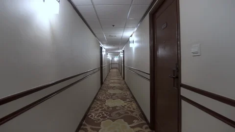 Point of View of Walking Down Old Fashioned Hotel Corridor Passing Through Rooms Stock Footage 121839726