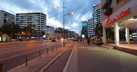 Point of view walking at dusk through center of Novi Sad, street crossing Stock Footage 318506275