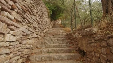 Point of view walking on a path to Assisi Stock Footage 82120643