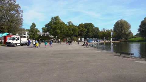 Point of view walking on shore of Olympiasee lake in Olympic Park Stock Footage 170895827