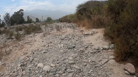 Point of view walking through rocks and sand of a dry river in cieneguilla, lima Stock Footage 141949486