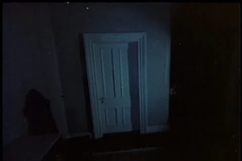 Point of view walking towards closed door and turning knob Stock Footage 11354181