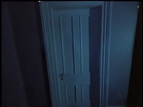 Point of view walking towards closed door and turning knob Stock Footage 260251918