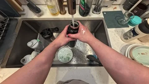 Point of view washing dishes. San Francisco CA USA November 20th 2025. Stock Footage 321981980