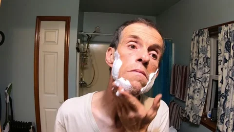 A Point of View of Watching Someone Lather Their Face Preparing to Shave Stock Footage 158387603