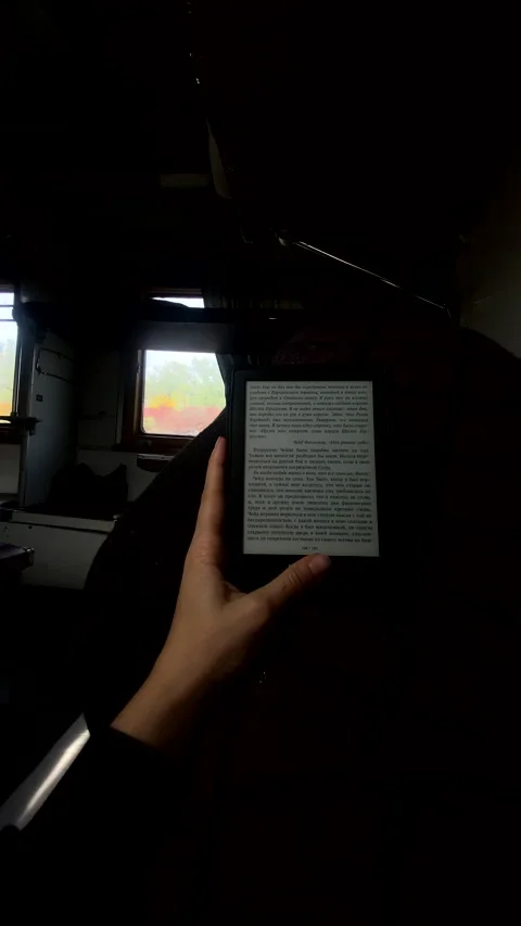 Point of view woman reading e book in train Stock Footage 222610942