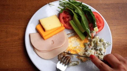 A point of view of a woman who eats a salad and fresh vegetables. Buffet Rest Stock-Footage 93155607