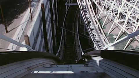 Point of view of wooden roller coaster traveling through wooden structure. 2K Video stock 168147062