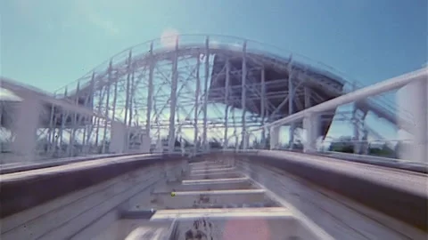 Point of view of wooden roller coaster speeding into a tunnel. 2K Video stock 168147135