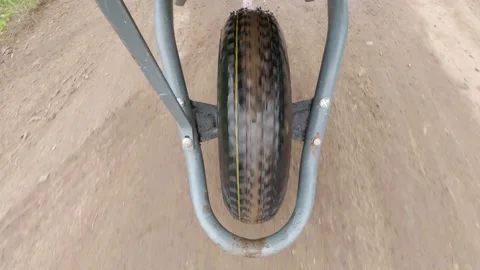Point of view. Work in the field concept. Close-up view of a wheelbarrow whee Stock Footage 167210229