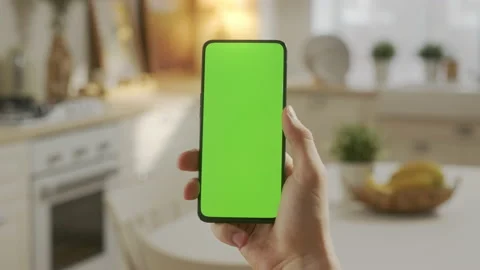 Point of View of Young Man at Home Sitting on Kitchen Room using With Green Mock Stock Footage 170765094