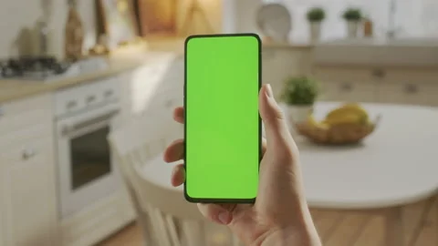 Point of View of Young Man at Home Sitting on Kitchen Room using With Green Mock Stock Footage 197400902