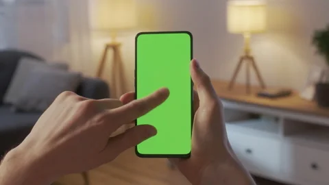 Point of View of Young Man at Home Living Room using With Green Mock-up Screen Stock Footage 205575642