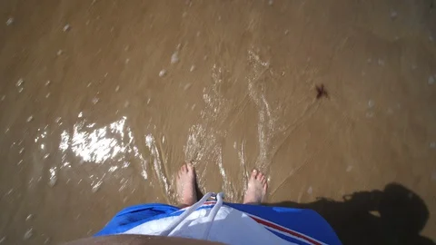 Point of view Young Man standing on Beach. Male legs Ocean Sandy 動画素材 128523973