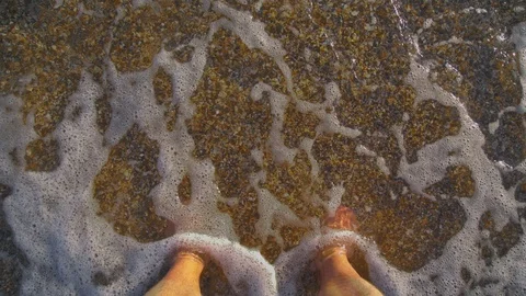Point of view of young man stepping at the golden sand at sea beach Stock Footage 90788945