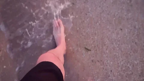 Point of view of young man stepping at the golden sand at sea beach Stock Footage 95035833