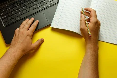 Point of view of a young man studying economics with different study stuff Foto stock