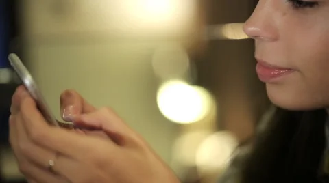 Point of view of a young woman using a smart phone for texting and browsing Video stock 56440847